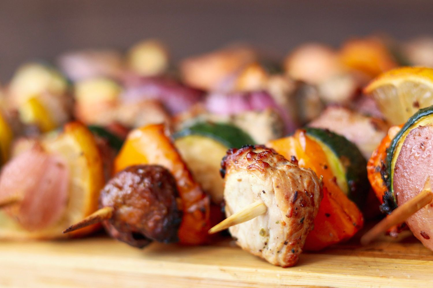Close-up of grilled kebabs with meat and vibrant vegetables.