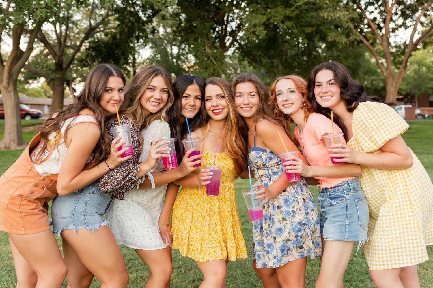 group of girls smiling at camera with lemonade