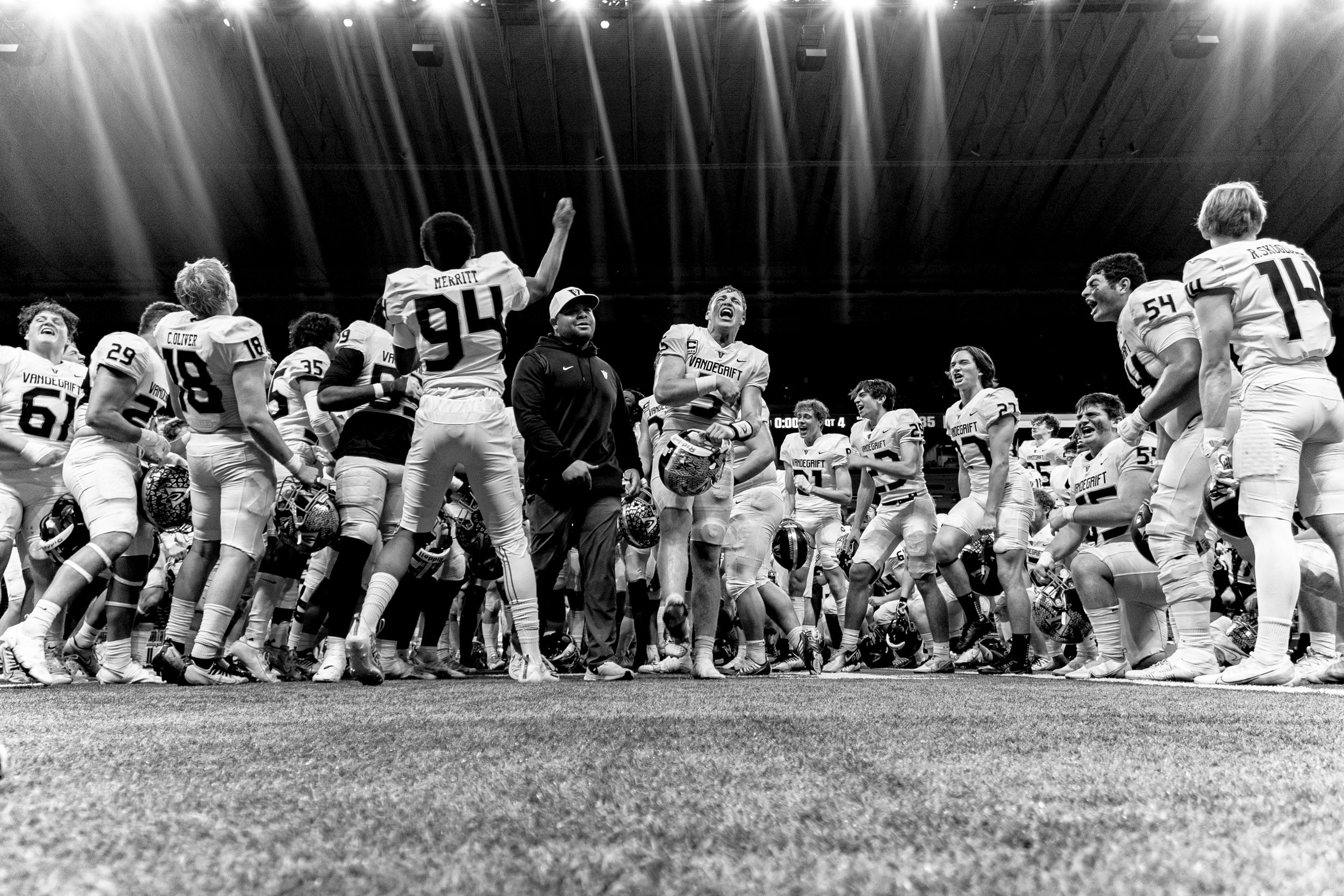 Black and white photo of vintage football game line of scrimmage.