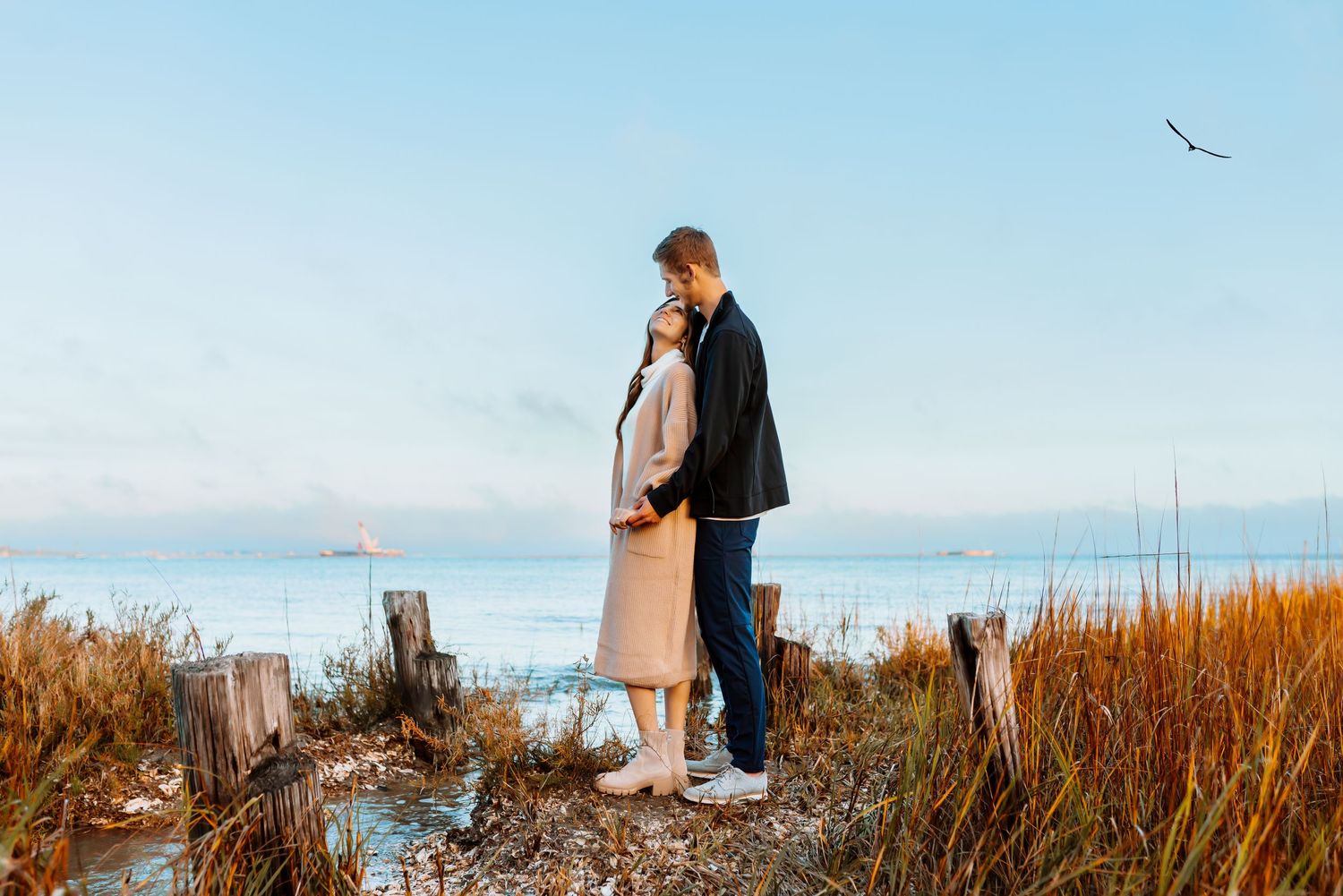 couple next to water looking at each other