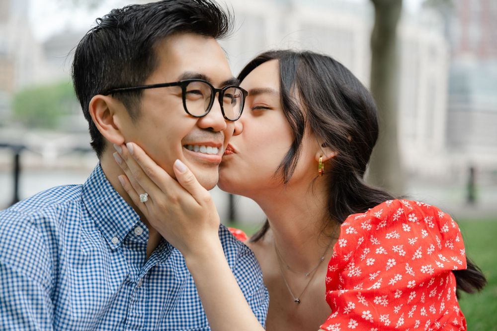 Intimate romantic moment between couple in urban setting.
