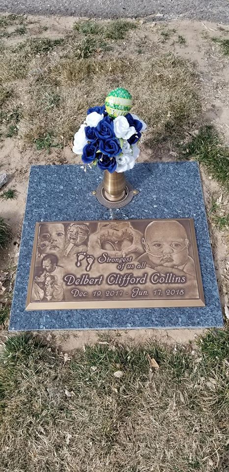 grave stone with photos on it of little boy who passed away from congenital heart disease