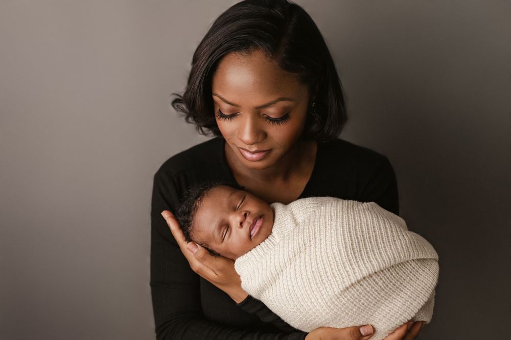 posed newborn portrait, studio baby boy, parent pose or mom and baby