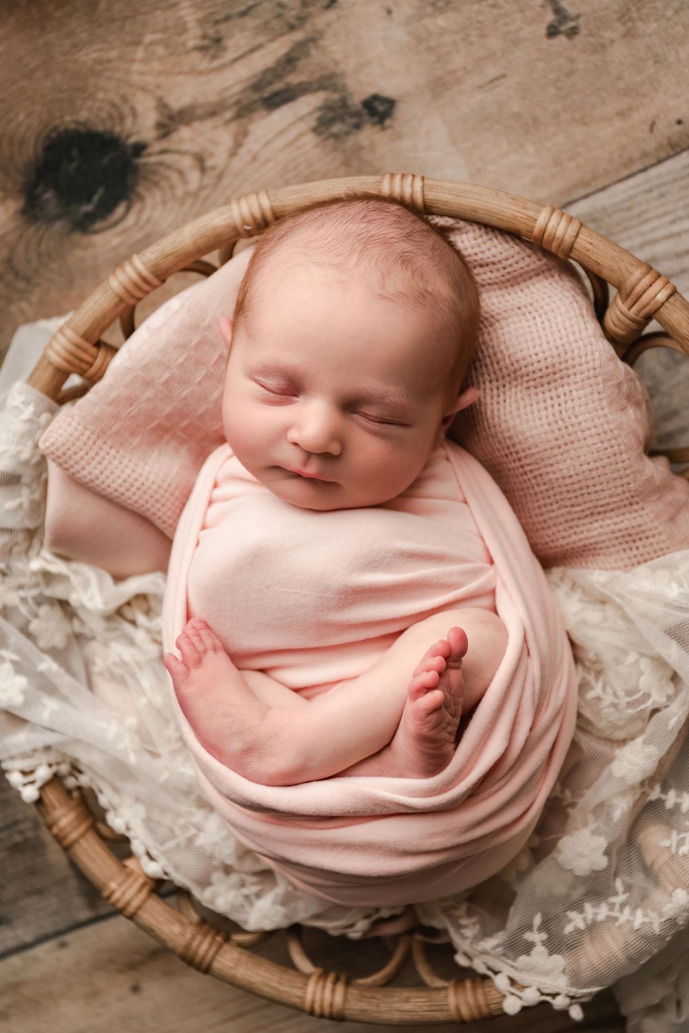 posed newborn portrait, studio newborn baby girl in wood bowl prop