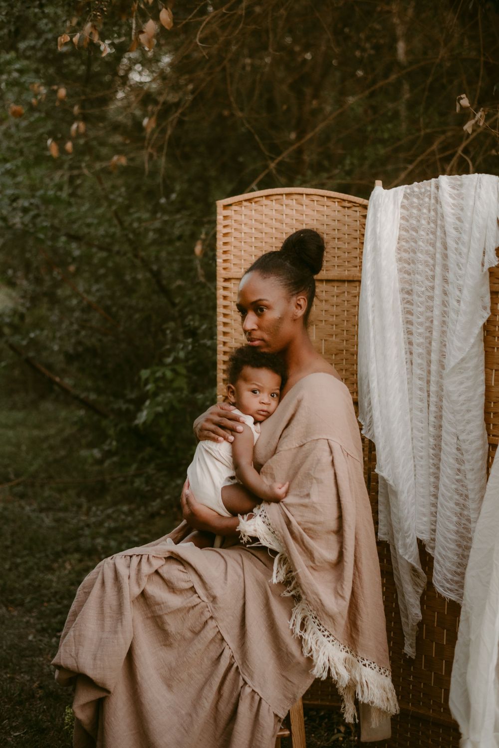 A Mother Holding Her Infant Son to her Chest wearing a Reclamation Gown in Seguin, Texas