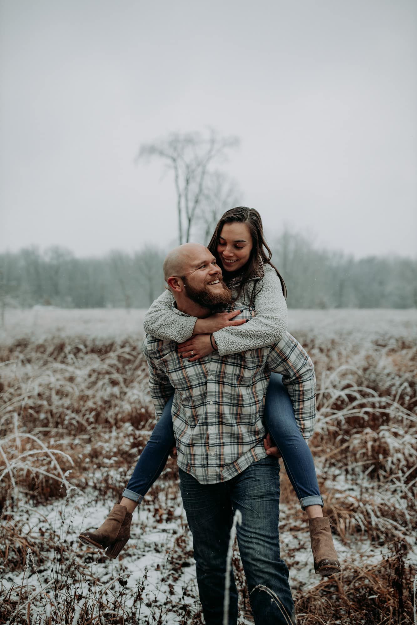 Bride-on-grooms-back-snow
