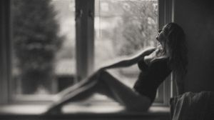 Minimalist black and white window scene with soft natural lighting.