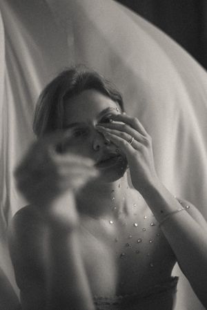 Delicate black and white portraits with ethereal fabric and sparkling details.