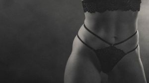Intimate black and white photography series with minimalist composition and dark tones.
