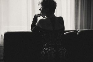 Dramatic black and white silhouettes photographed against window light in an interior setting.