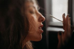Artistic profile portraits captured in natural window light with soft shadows.