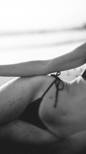 Minimalist black and white close-up study showing gentle curves and shadows.