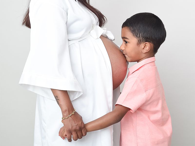 Mother and son in maternity photo shoot. High Wycombe family portrait studio. Photographer Abigail's Studio