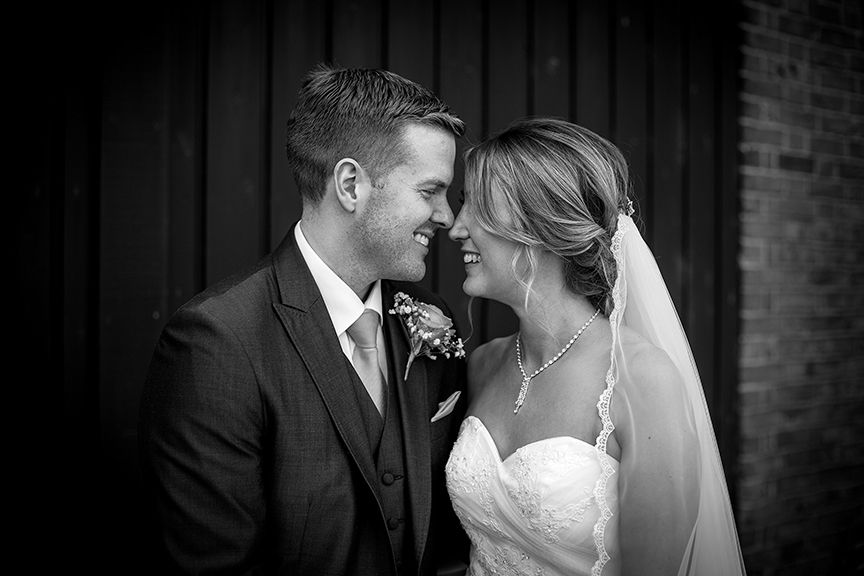 Bride & Groom touching noses at The Windmill wedding venue