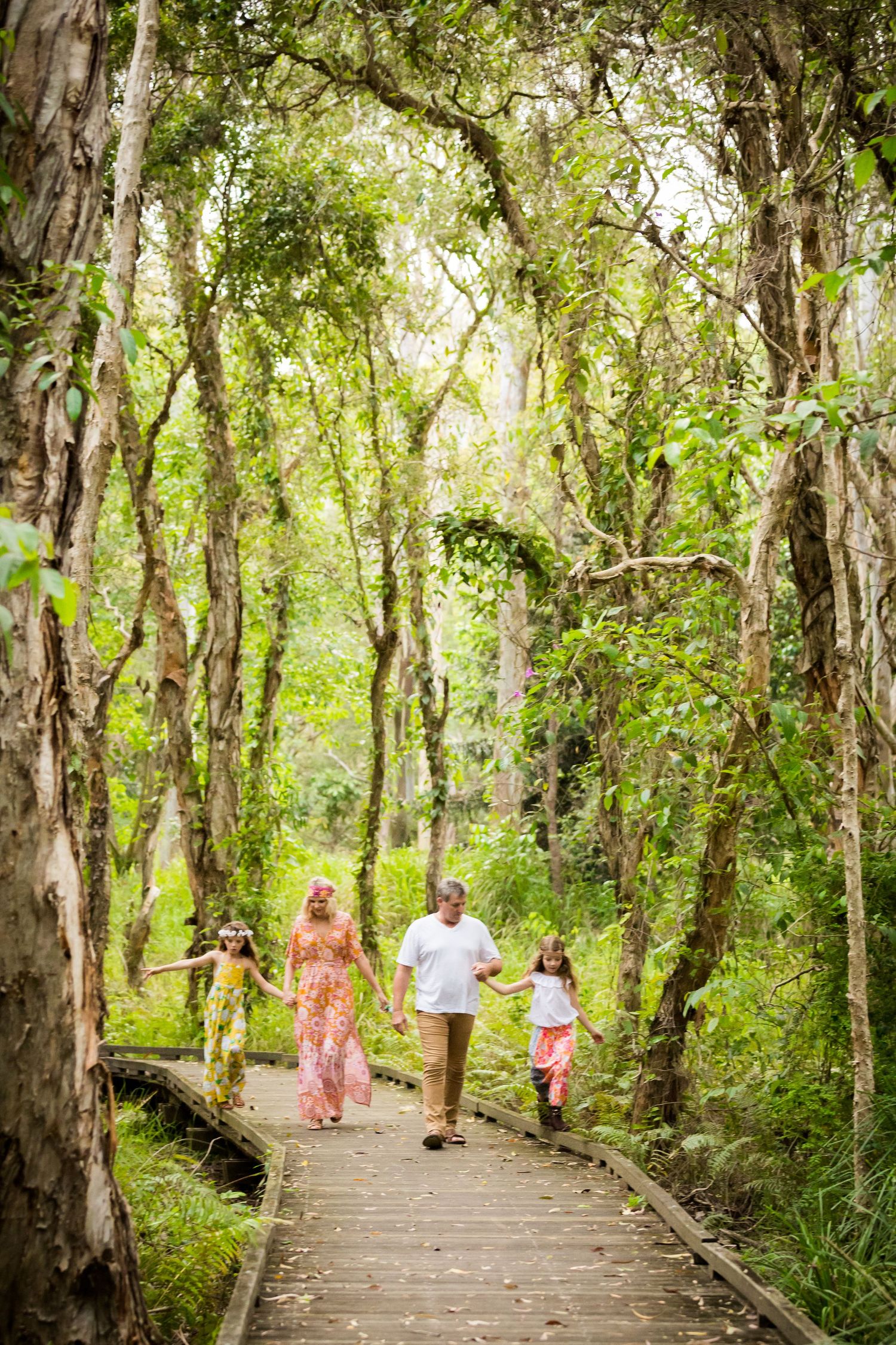 family walking along the boardwalk north brisbane photographer