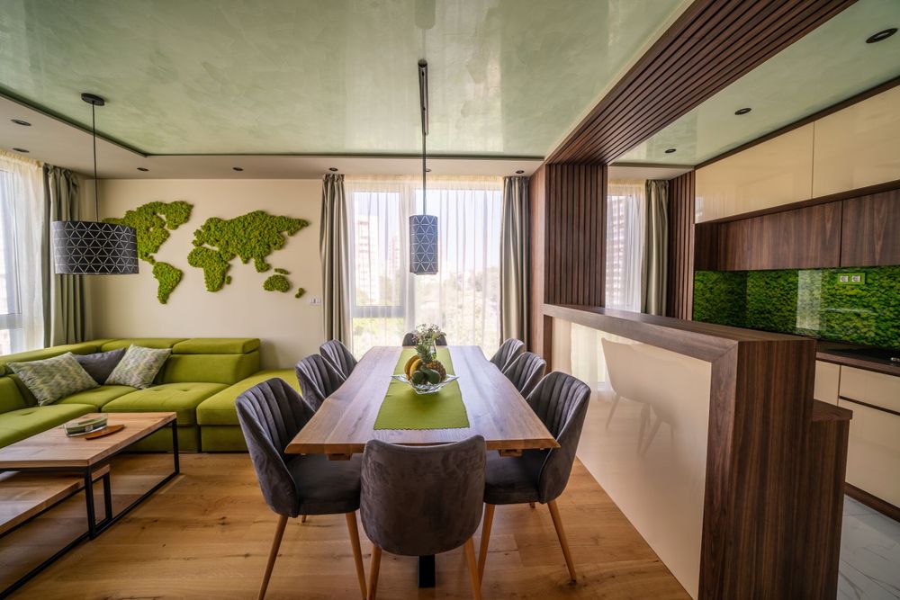 Contemporary dining area with world map decor, lime green accents, and pendant lighting.