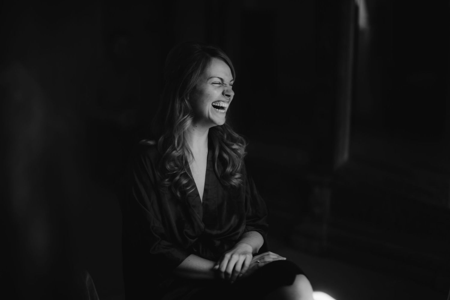 Candid moment captured in black and white showing natural emotion.