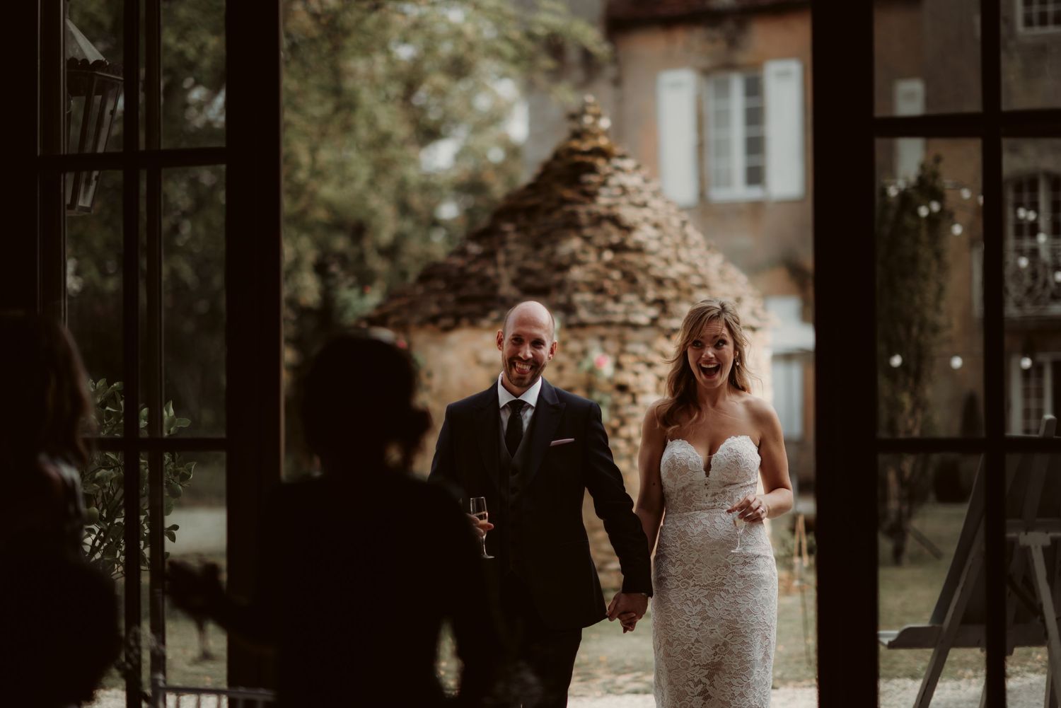 Wedding celebration in a charming French countryside estate with stone architecture.