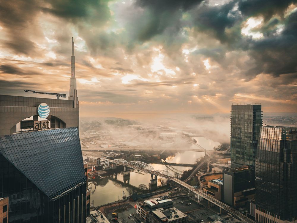 Raw Element Productions drone photograph of At&t Building or Batman Building downtown Nashville overlooking the river.
