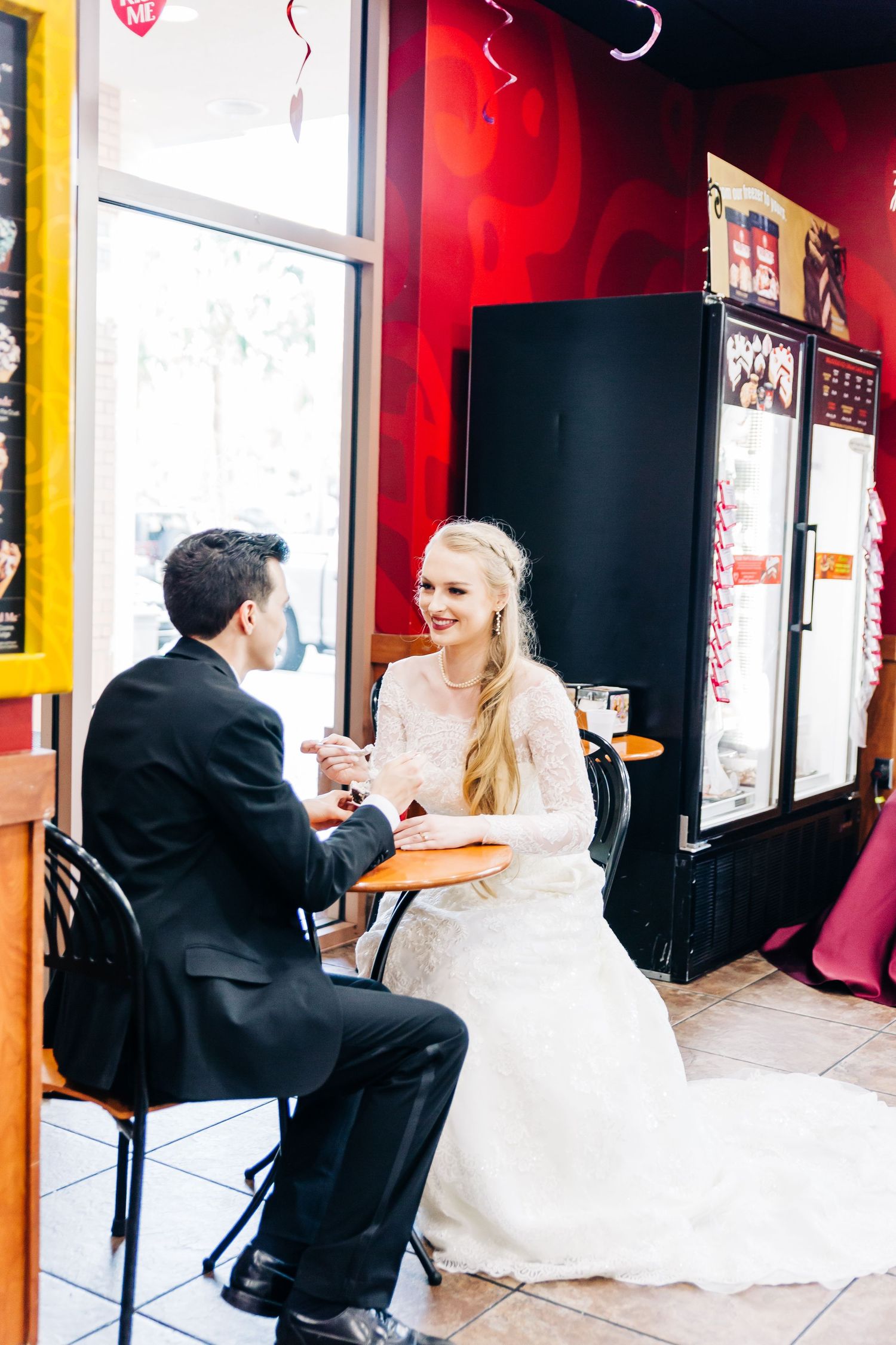 Bride and groom sharing ice cream inside Cold Stone Creamery Safety Harbor