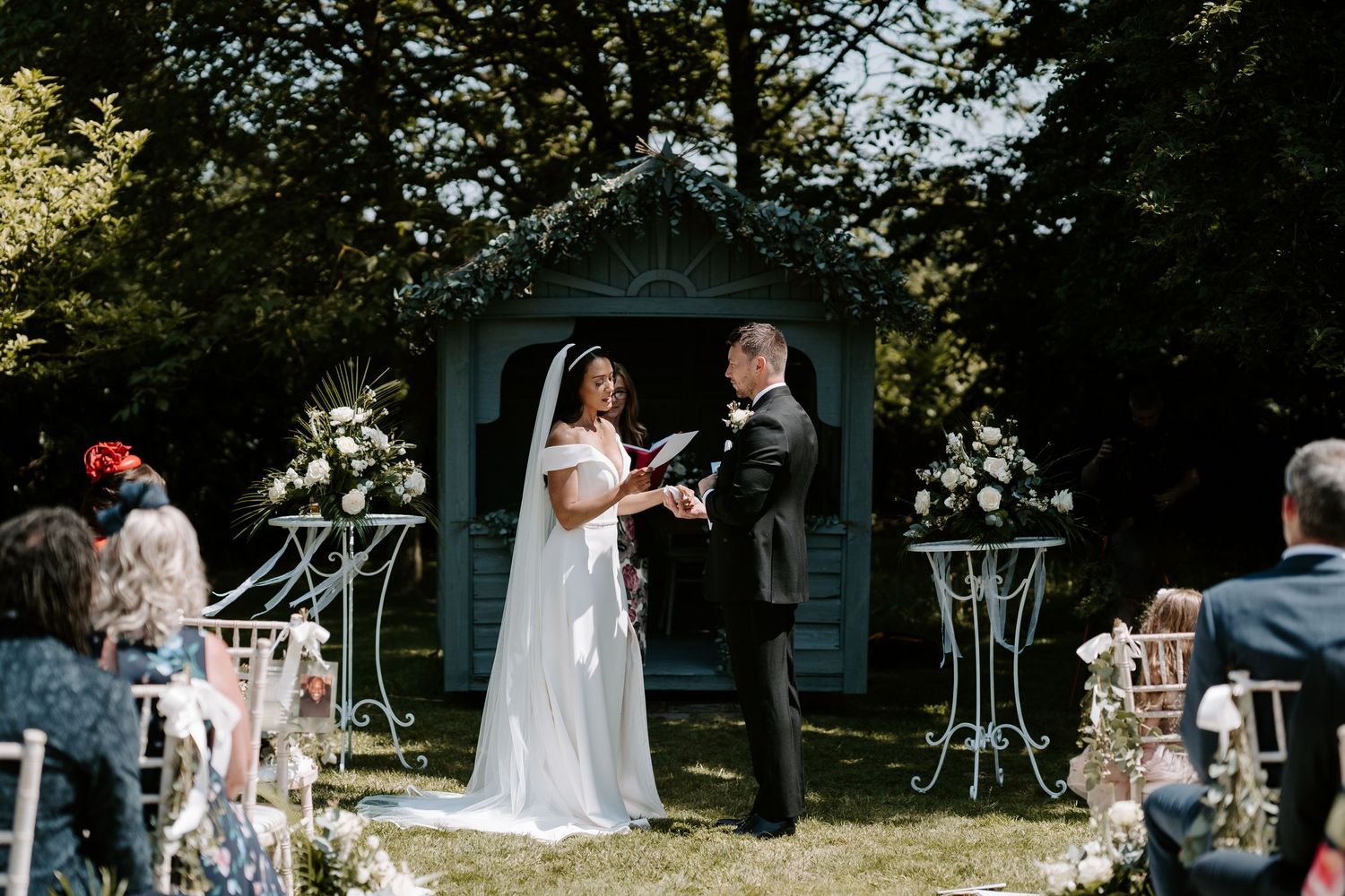 bride-reading-vowels-stockton-house-outdoor-wedding-ceremony