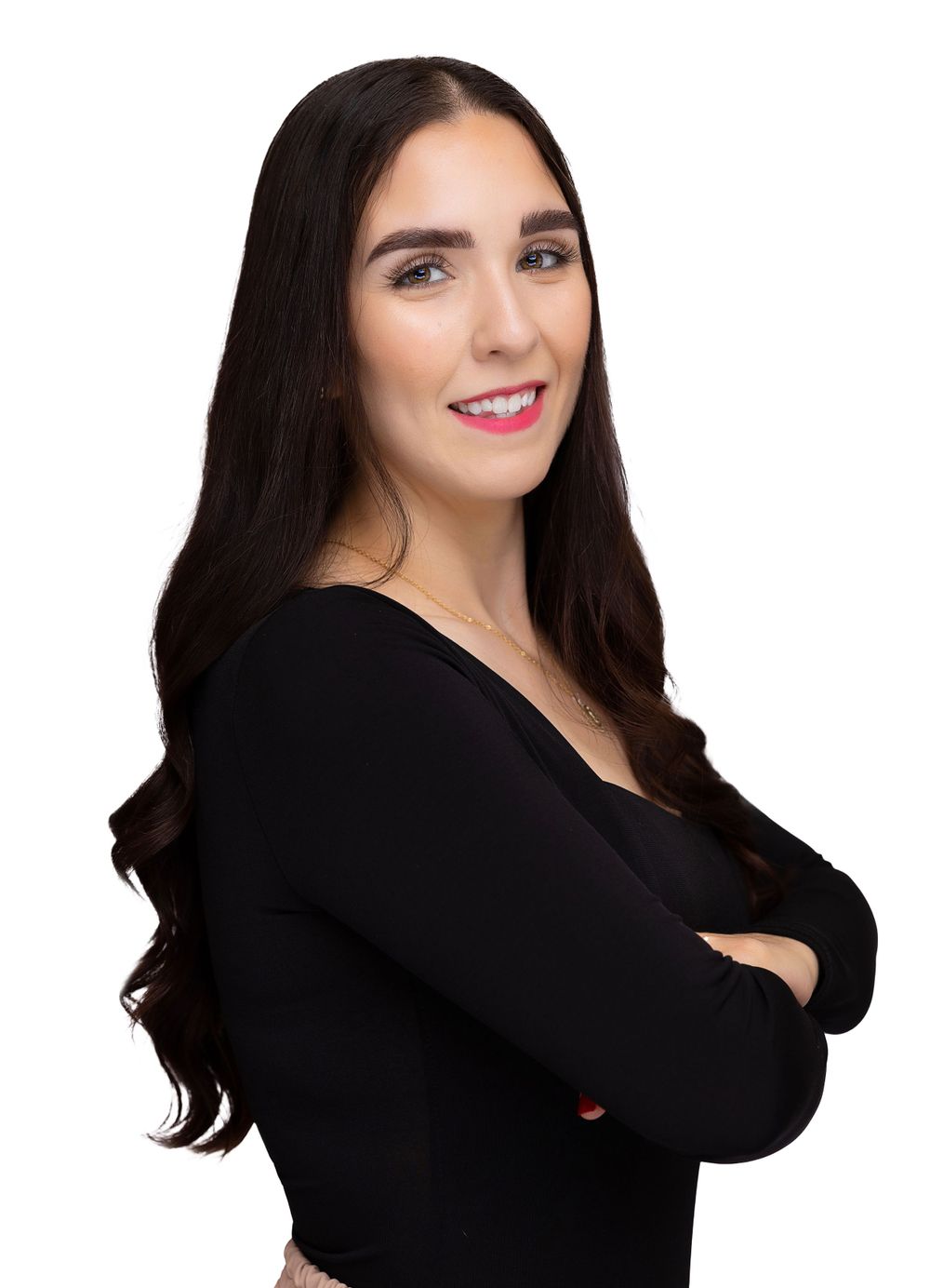 Studio portrait with long dark hair and black top against white background.