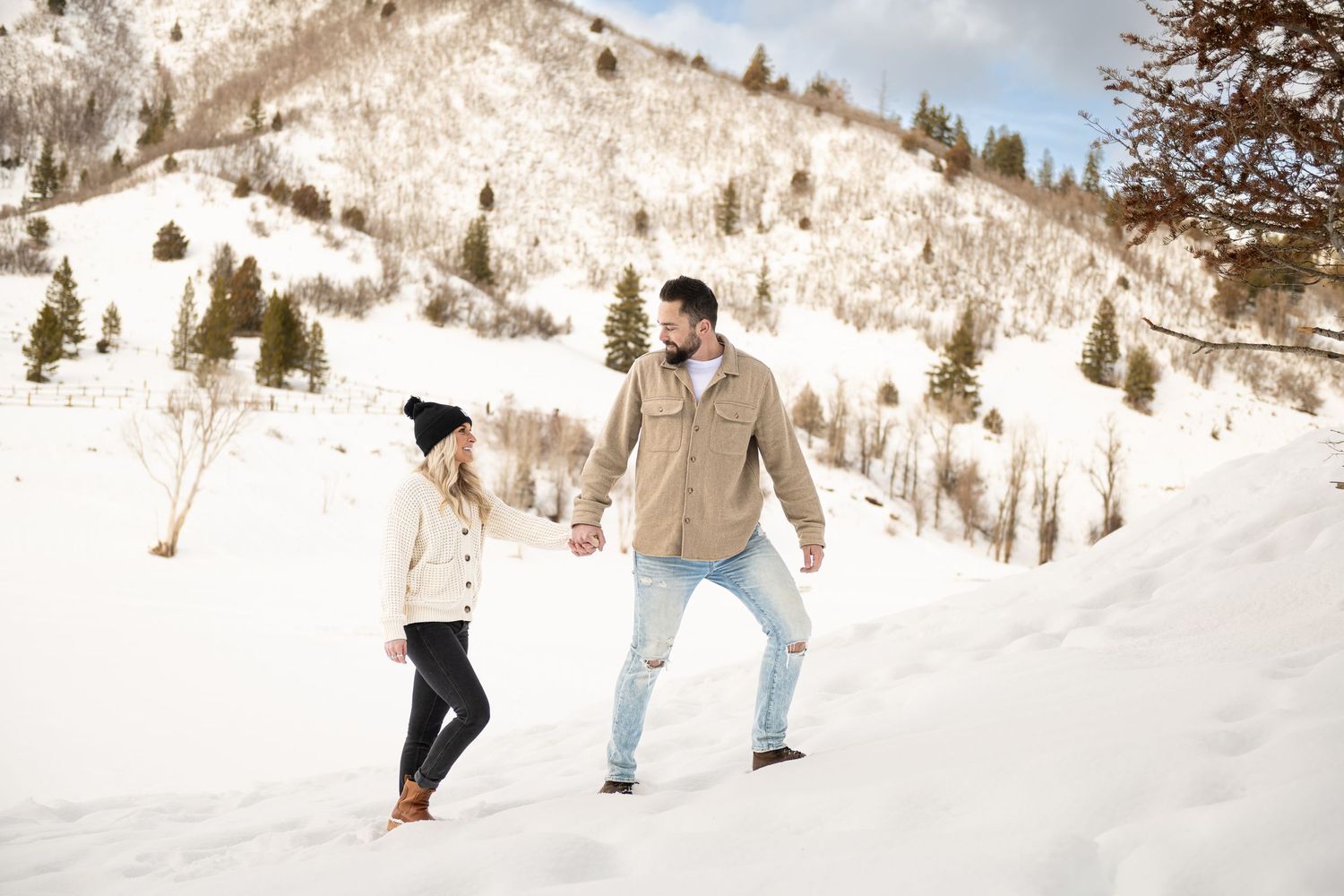 Snow photoshoot in Utah mountains of an engaged couple