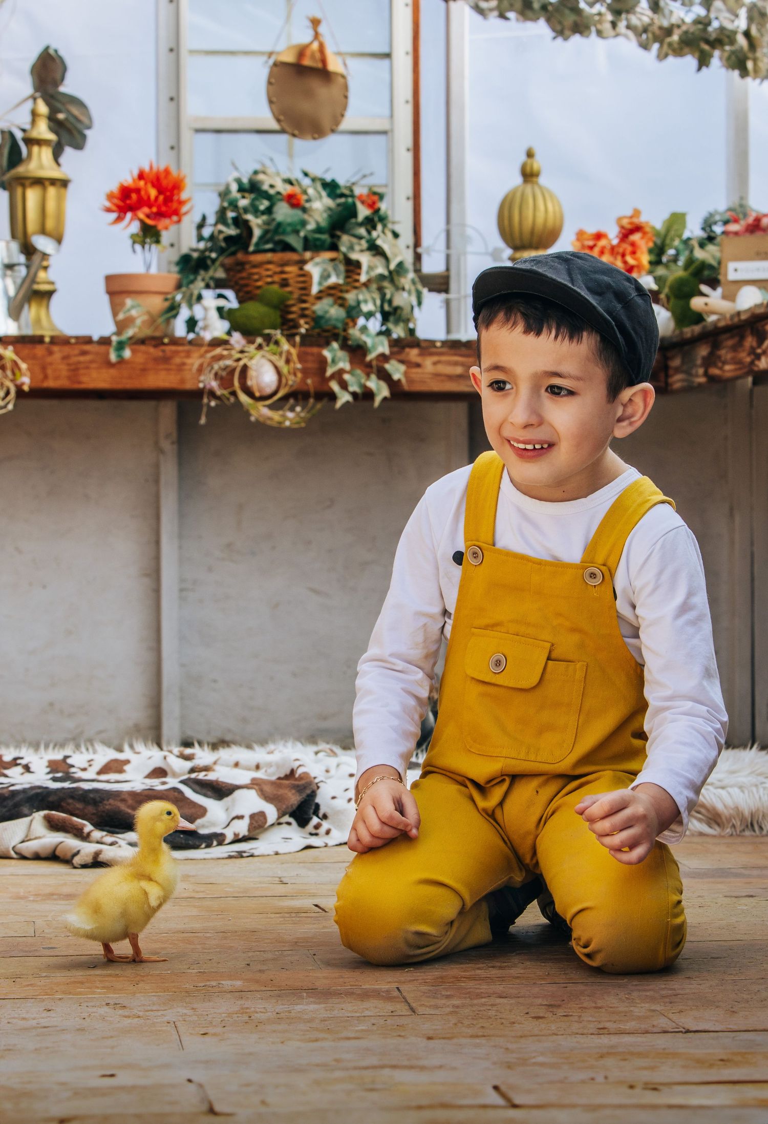 boy smiling at duck