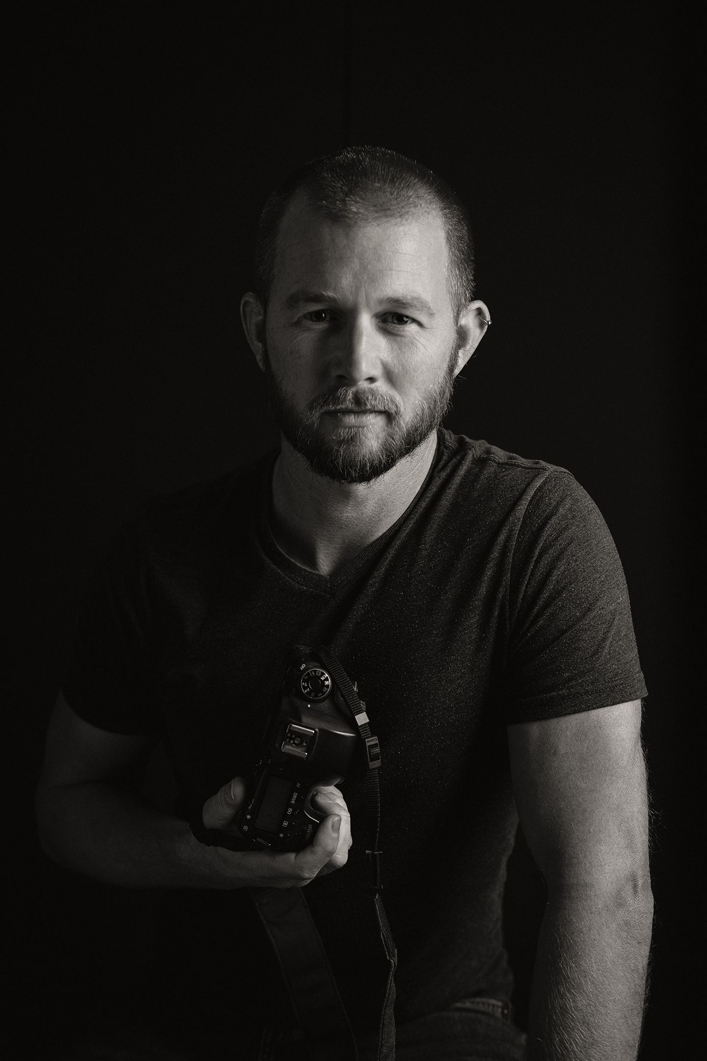 A black and white portrait of Brett Larson of Brett Larson Photography