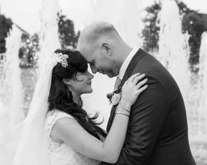 Black and white wedding photos showing intimate moments between newlyweds.