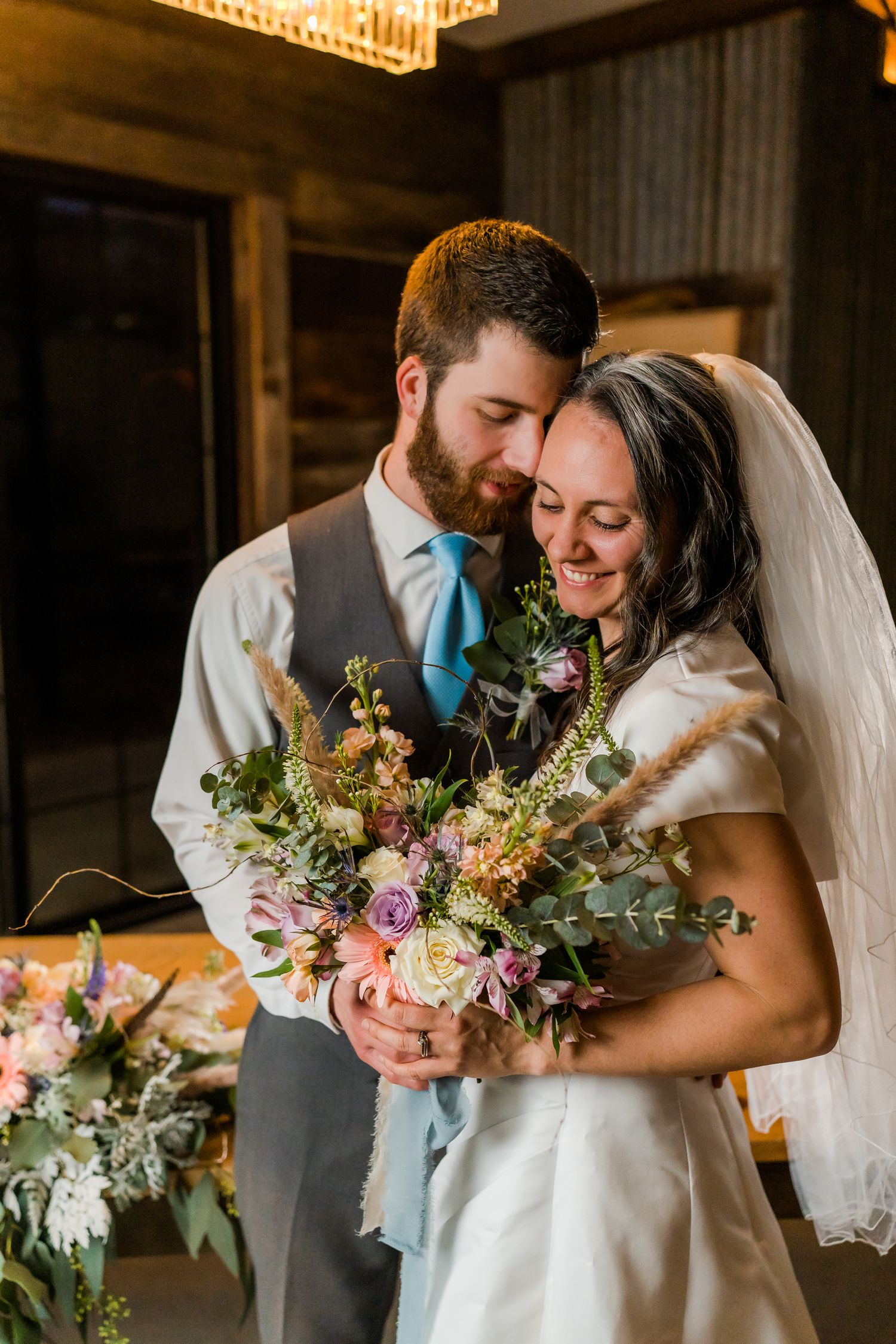 bride and groom nuzzle