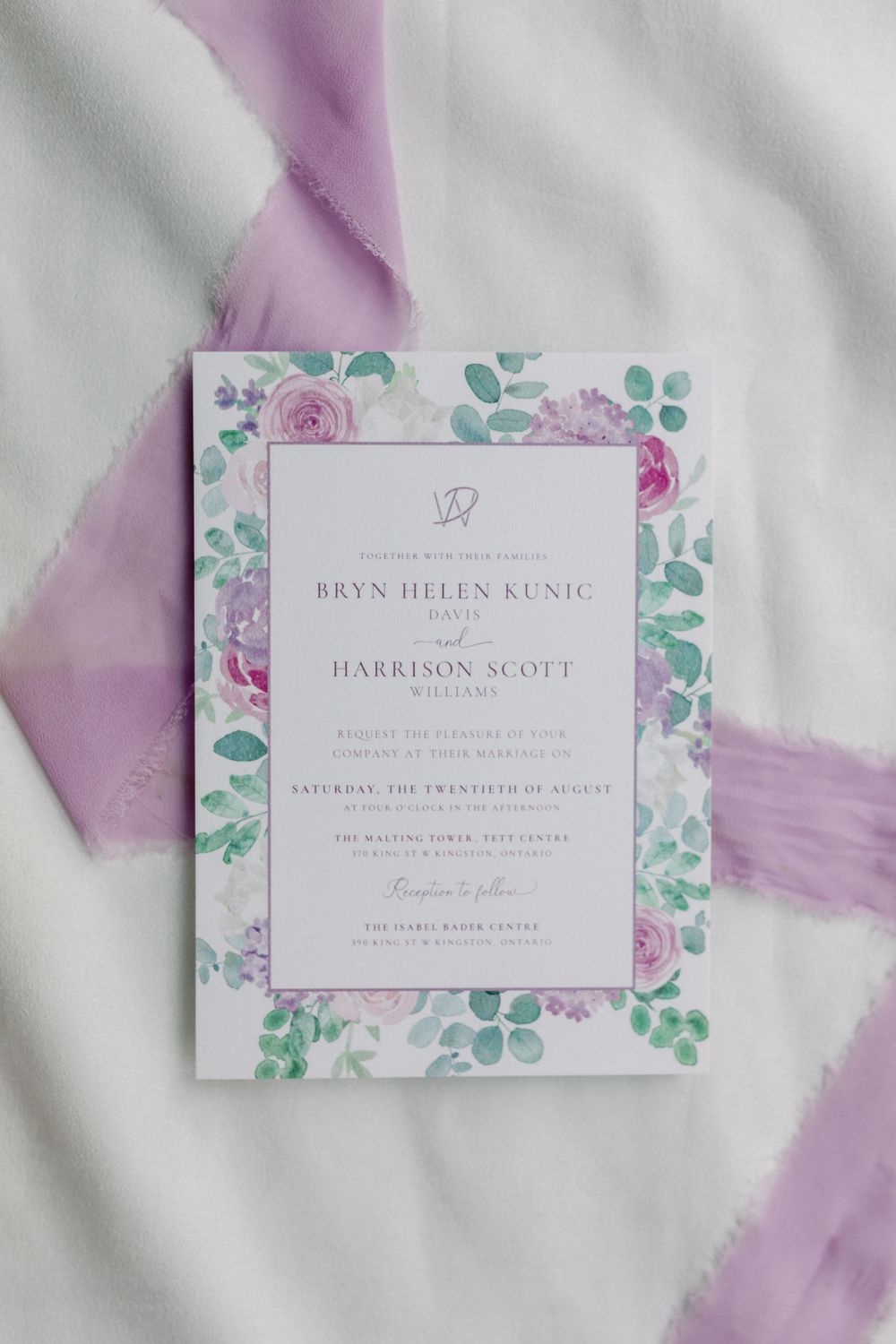 Delicate floral wedding invitations with purple and mint green watercolor design.