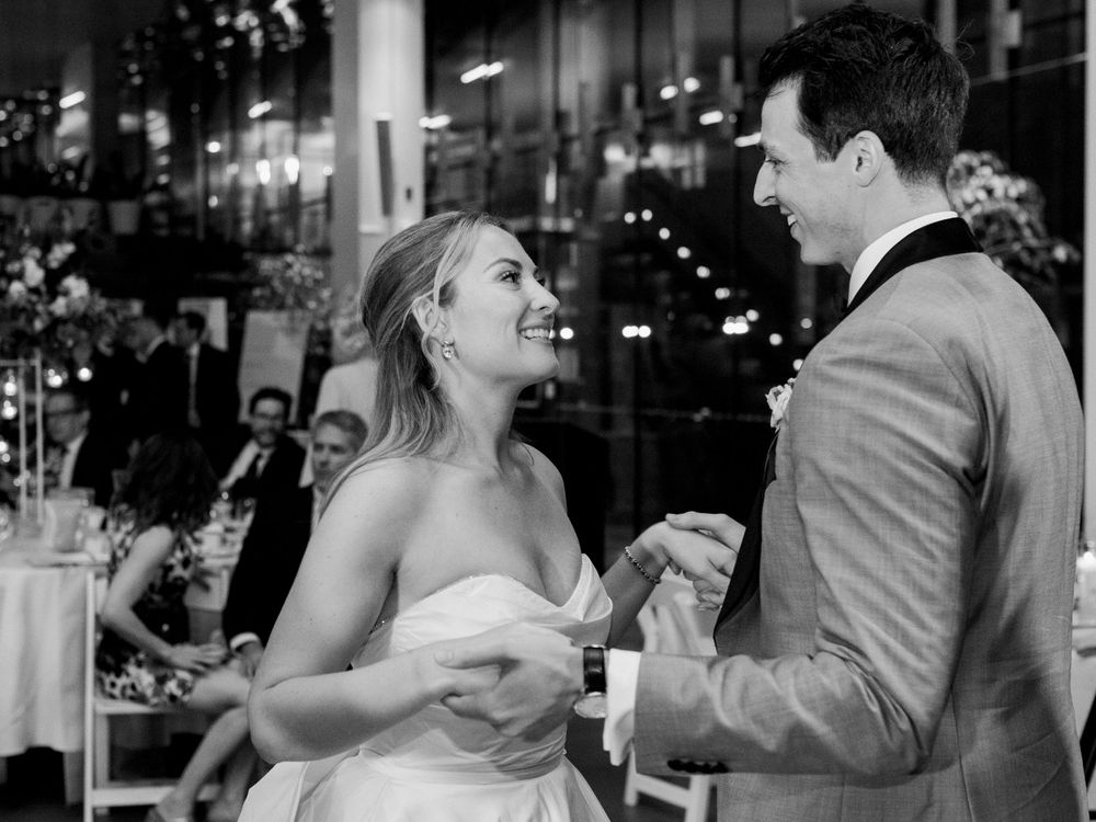 Evening wedding reception celebrations with ambient lighting and joyful moments.