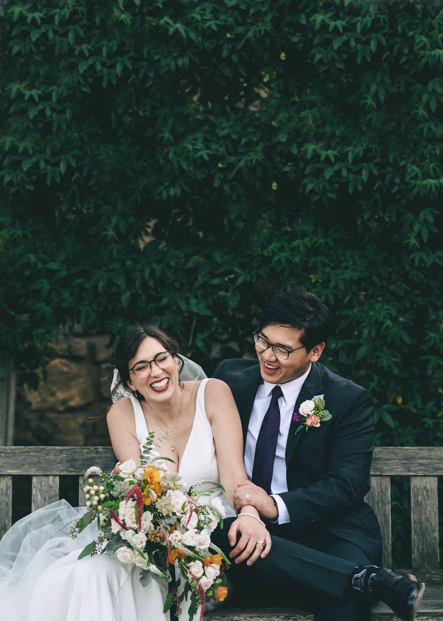 Bride and groom laughing, in the garden at the barns at cooper molera in Monterey
