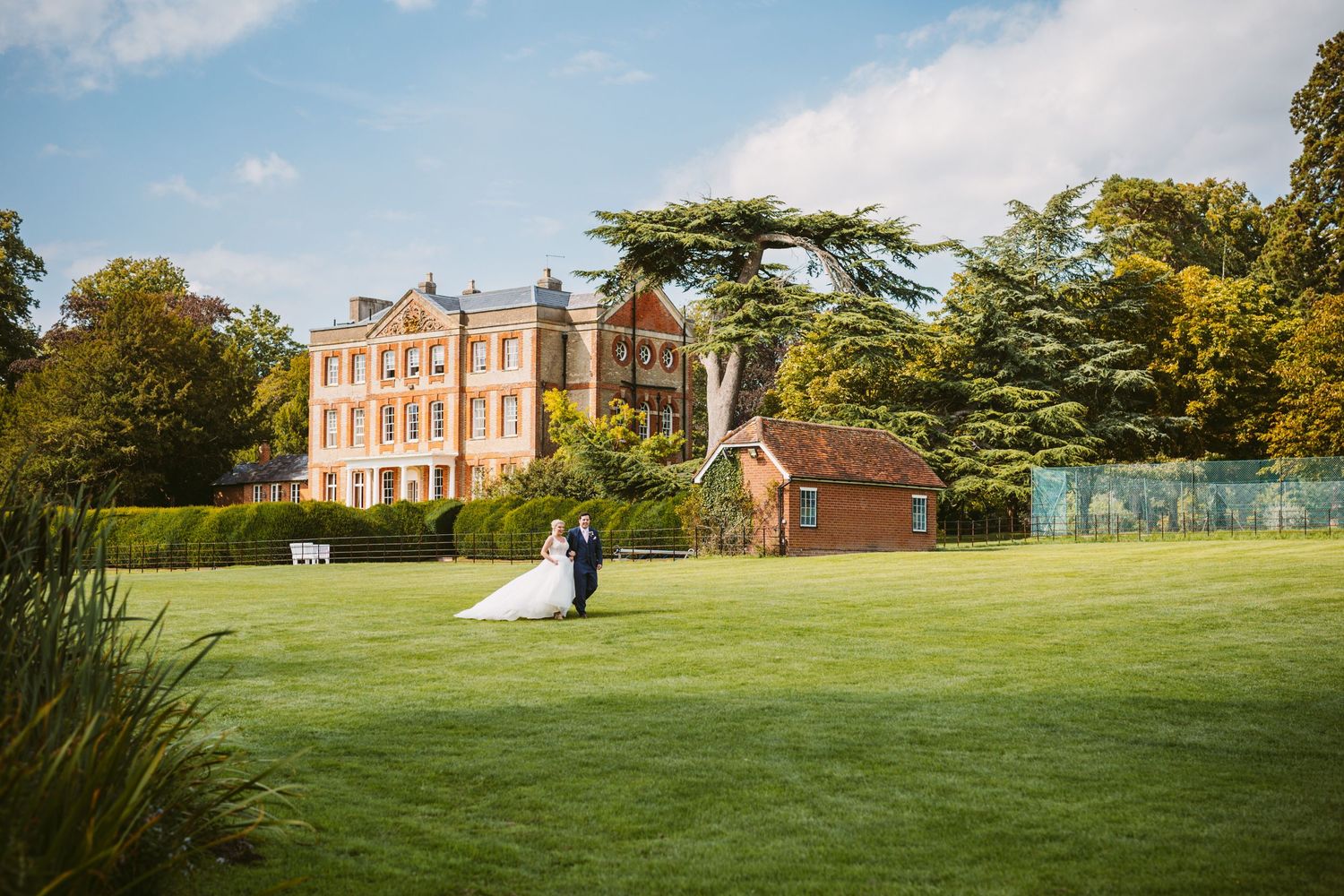 Ardington House beautiful, quintessential English Georgian Grade II listed stately home bride groom walking lawn Vicky Lewis Photography