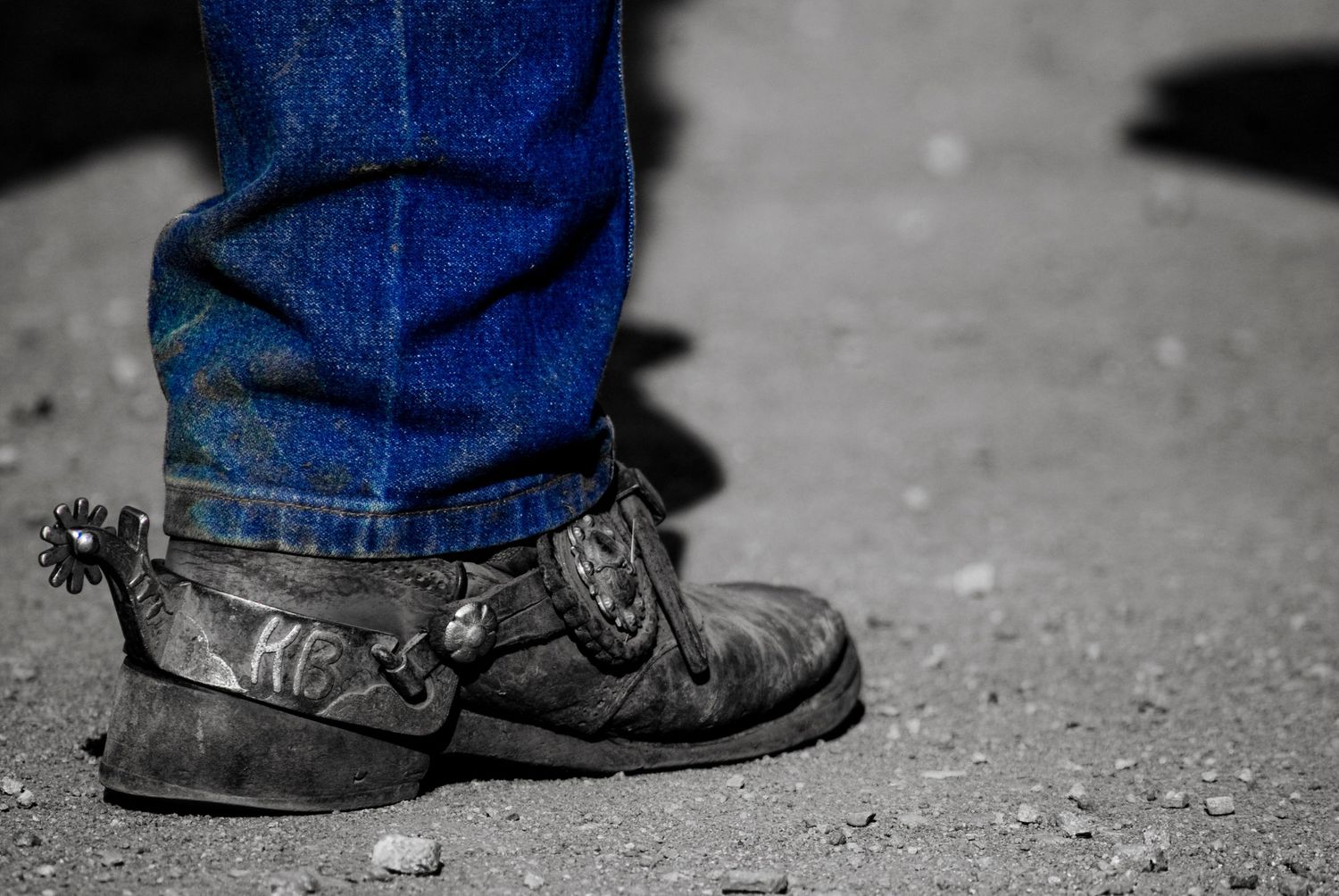 Worn cowboy boot heel with spur in helps tell the photography story
