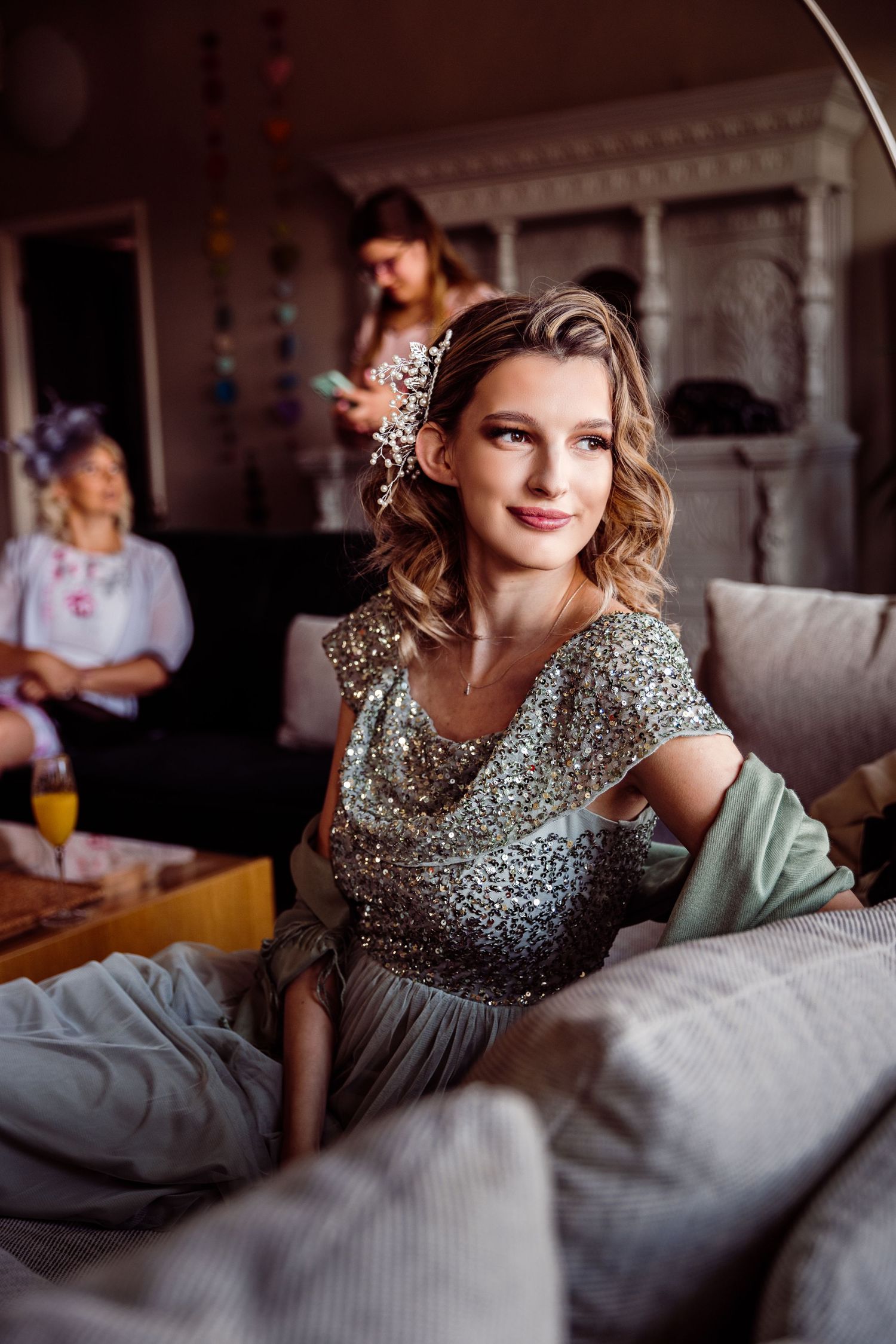 Natural photo of bridesmaid in sequinned green dress