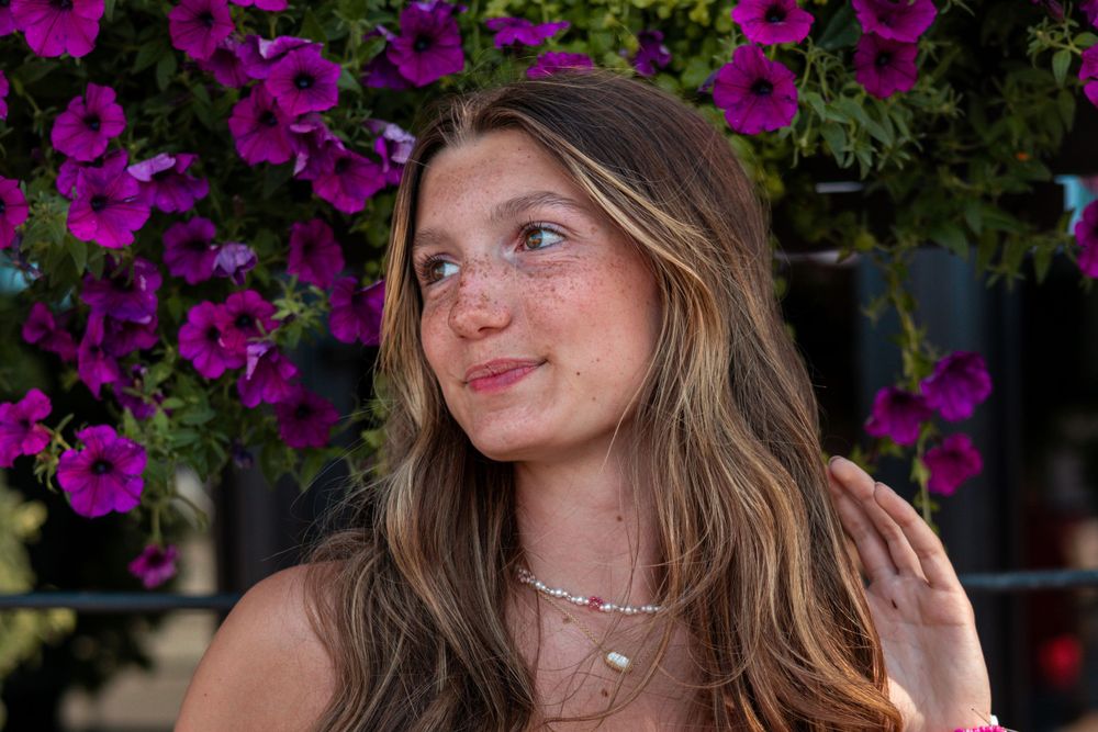 Portrait sequence with purple flowers in garden setting.