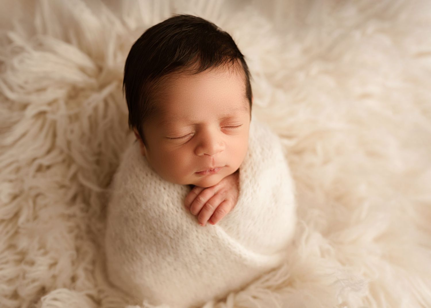 Baby boy wrapped newborn photos in professional newborn photoshoot in Moreno Valley ca