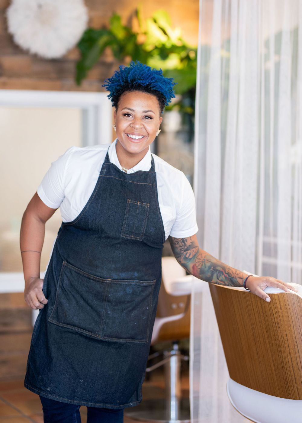 portrait of leading curly hair specialist christin brown in her salon