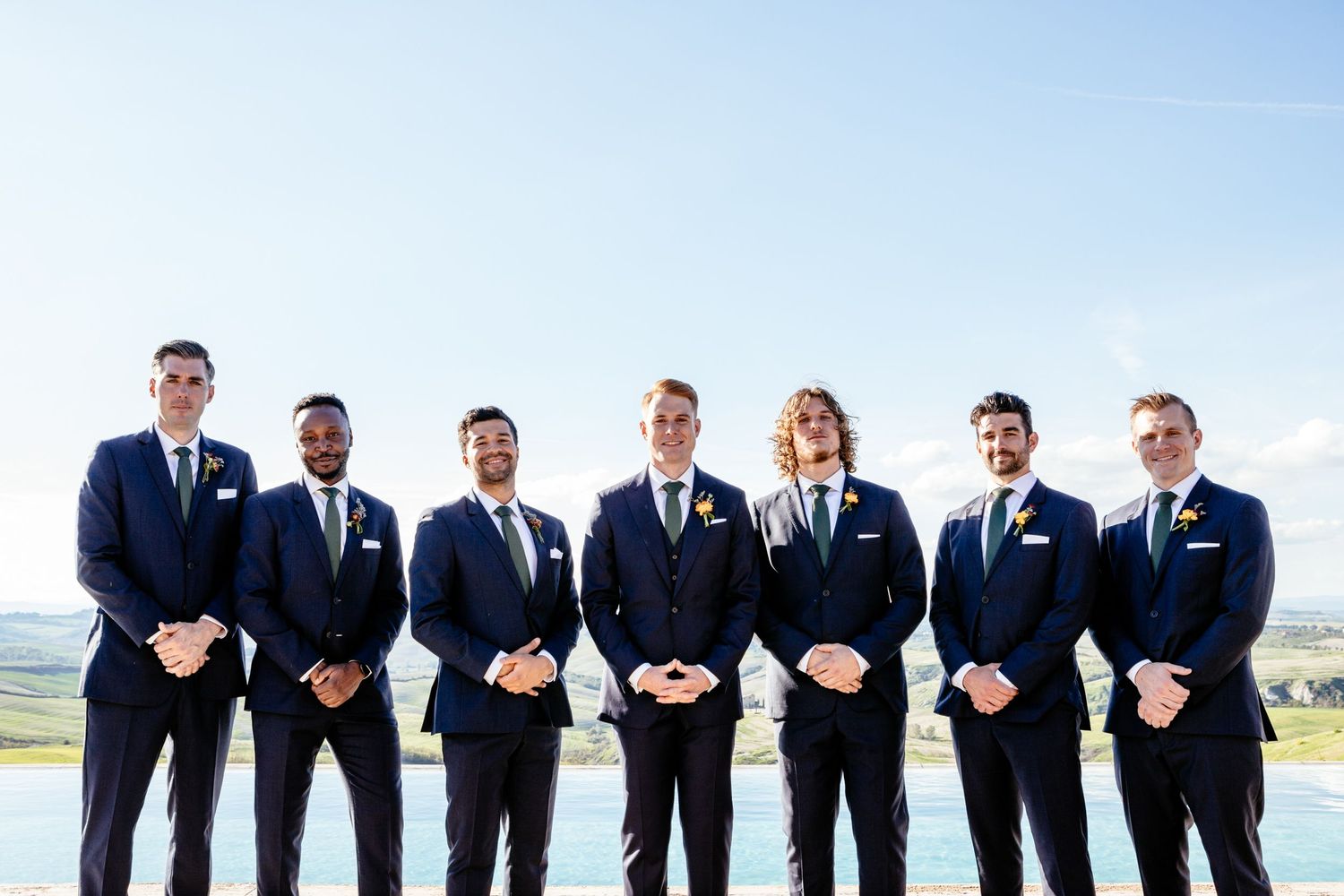 Groom and groomsmen in a group photograph at this destination wedding near Siena.