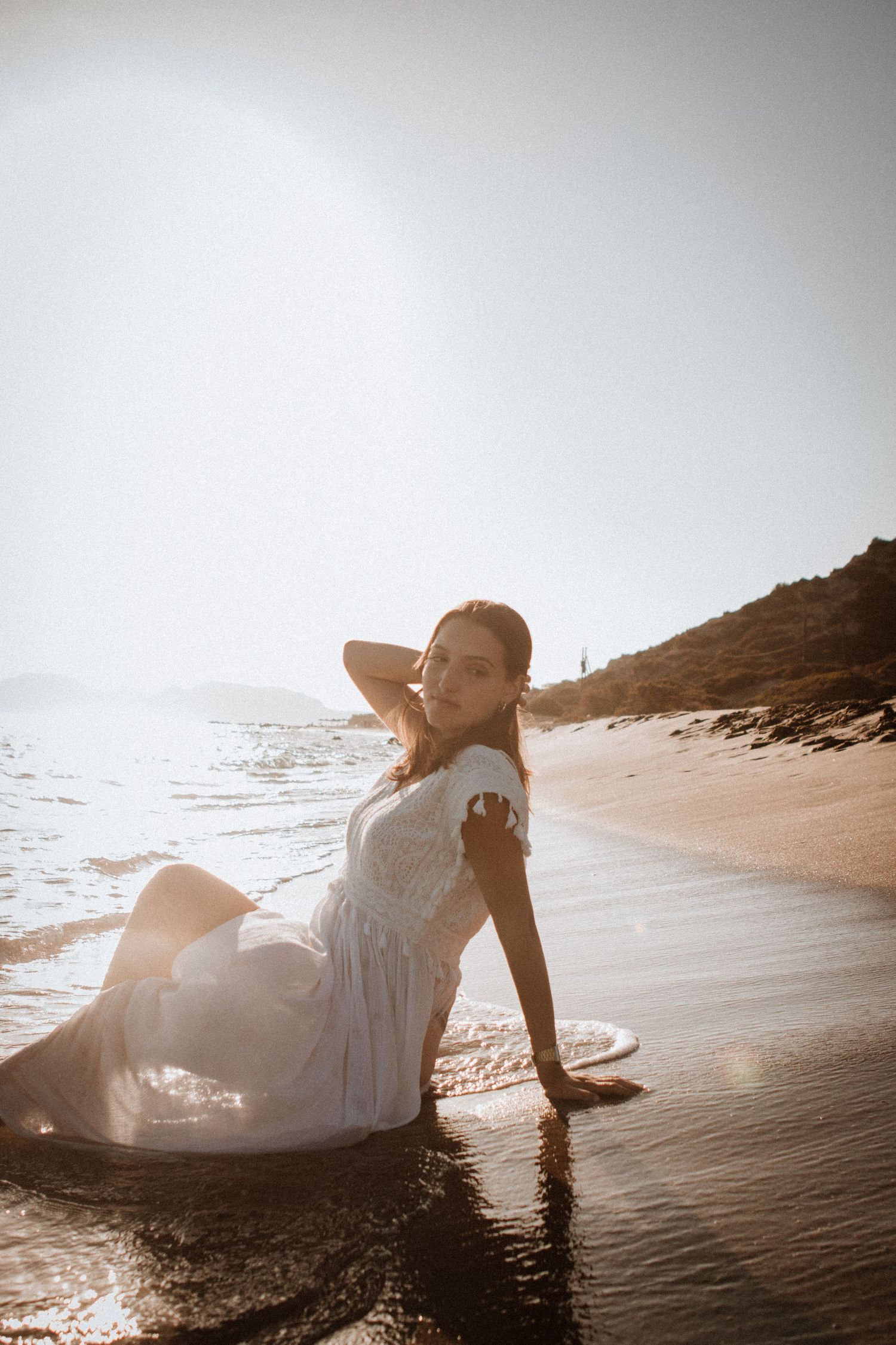Vintage feel outdoor empowerment photoshoot on beach at golden hour in Kos, Greece
