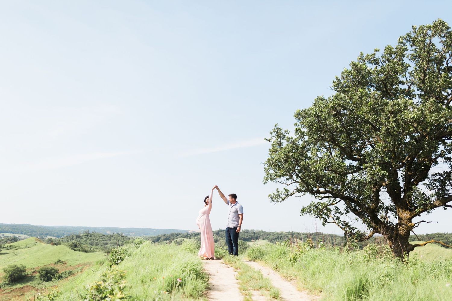 maternity photos at hitchock nature center, light airy iowa photographer, pink maternity dress, twirling maternity dress