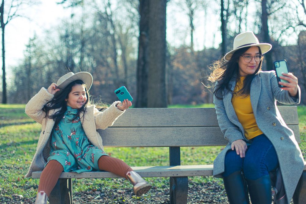 mom and daughter taking a selfie