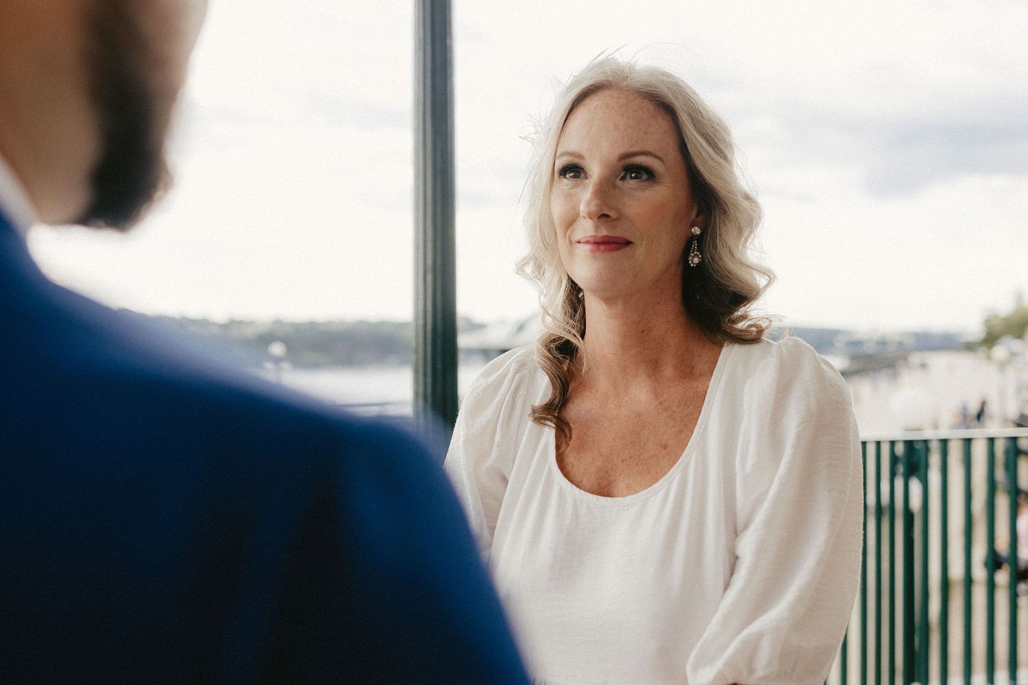 An intimate wedding moment captured on a scenic balcony overlook.