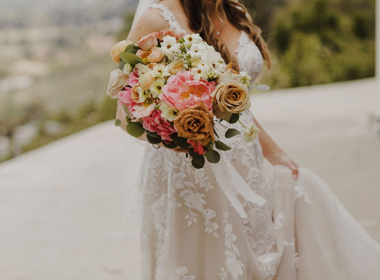 E Noelle Photography in-home wedding in Hidden Hills Los Angeles, bridal orange, pink, and white floral bouquet