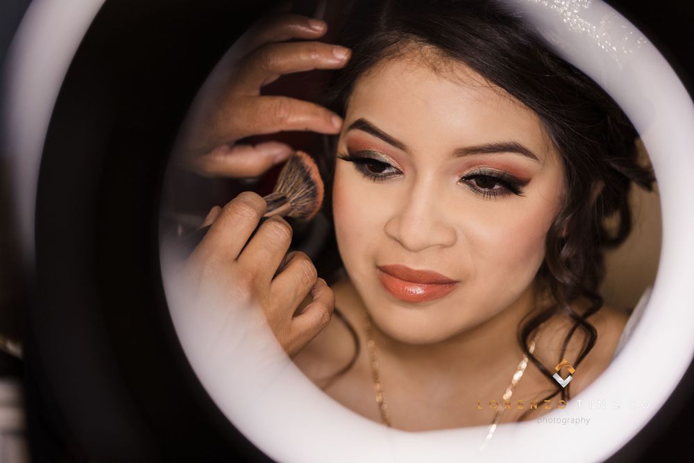Close-up beauty shot showing detailed makeup application and sparkly crown.