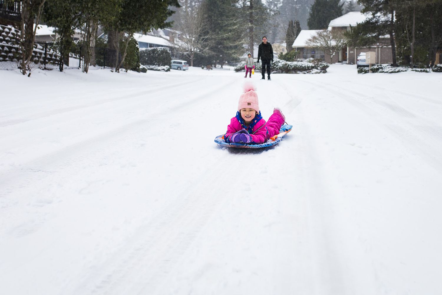 My other daughter riding a sled in our neighborhood