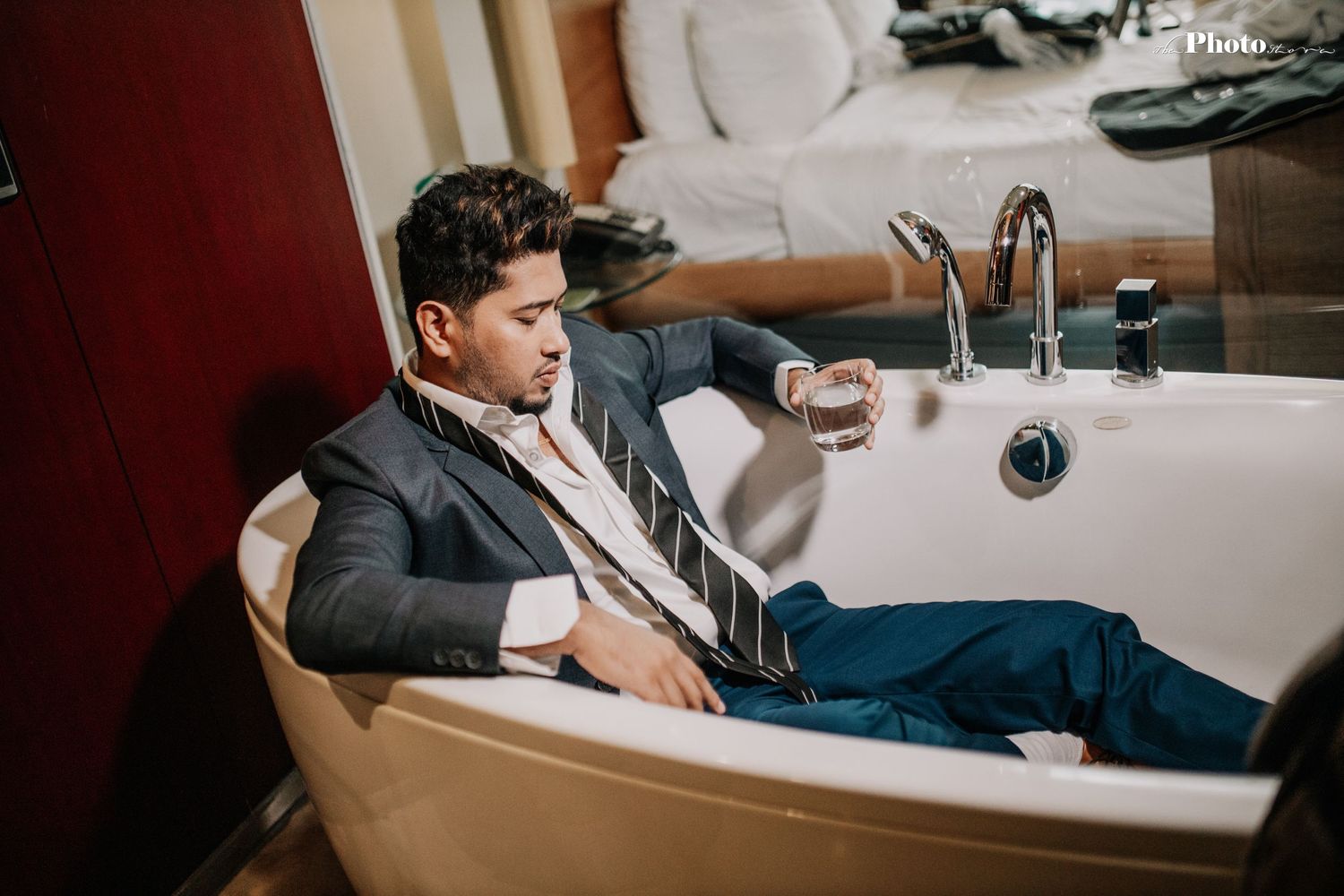 Luxury bathroom interior with modern fixtures and white bathtub.