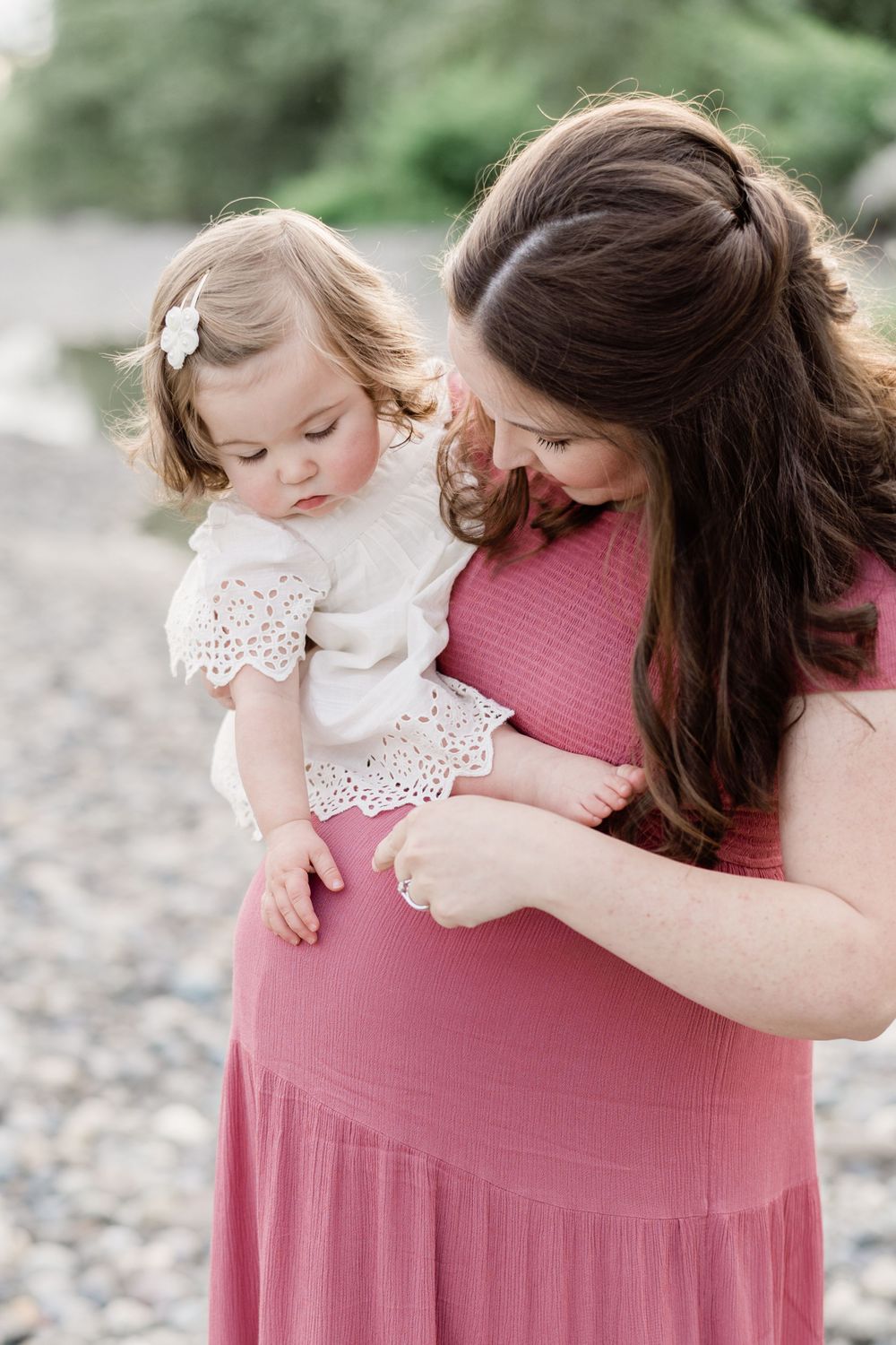 mom with baby maternity in a pink dress